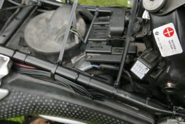 Cable ties attached under the couch of motorcycle
